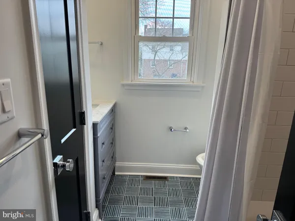 a bathroom with a double vanity sink and mirror