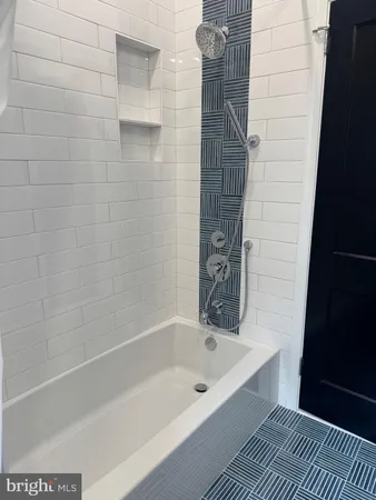 a bathroom with a sink a mirror and a window