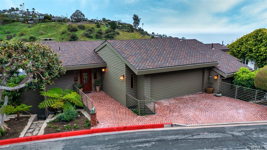 a aerial view of a house with a yard