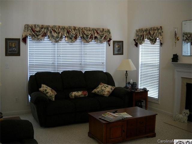 128 Lighthouse Road Mount Holly, NC 28120 - Photo 2 of 16 a living room with furniture and a window