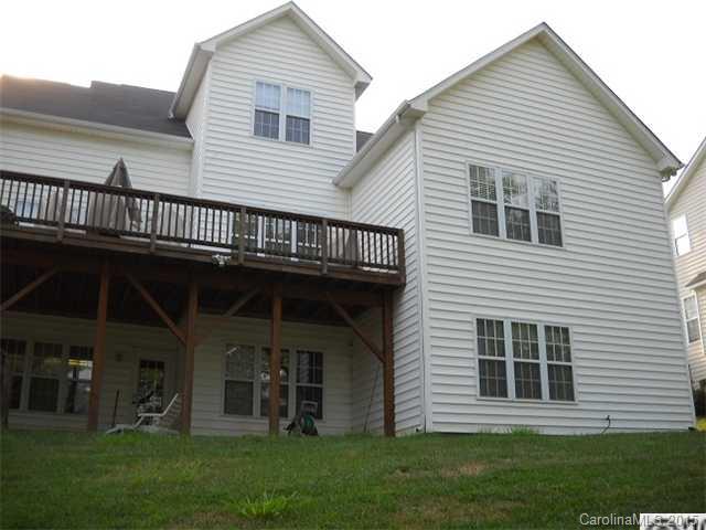 128 Lighthouse Road Mount Holly, NC 28120 - Photo 13 of 16 a view of a house with a yard and a large window