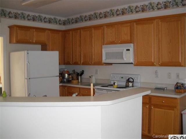 128 Lighthouse Road Mount Holly, NC 28120 - Photo 5 of 16 a kitchen with a sink and cabinets