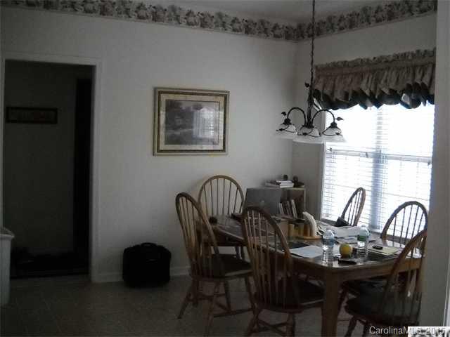 128 Lighthouse Road Mount Holly, NC 28120 - Photo 6 of 16 a view of a dining room with furniture window and outside view