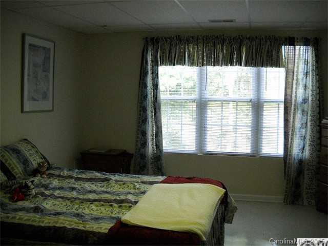 128 Lighthouse Road Mount Holly, NC 28120 - Photo 10 of 16 a bed sitting in a bedroom next to a window