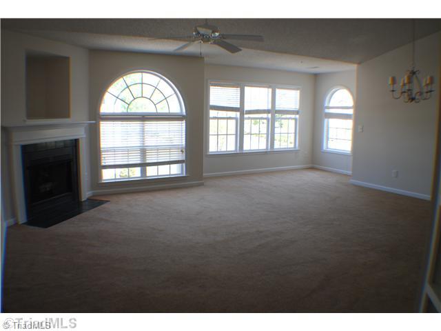 125 James High Point, Unit 3A High Point, NC 27265 - Photo 3 of 14 Dining Room. Extended Dining area. Living room w/ fireplace and TV niche.