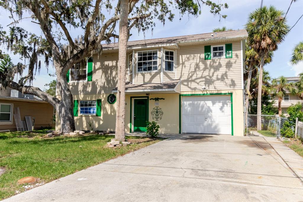 7804 Wilmar Court Port Richey, FL 34668 - Photo 1 of 82 front view of a house with a yard
