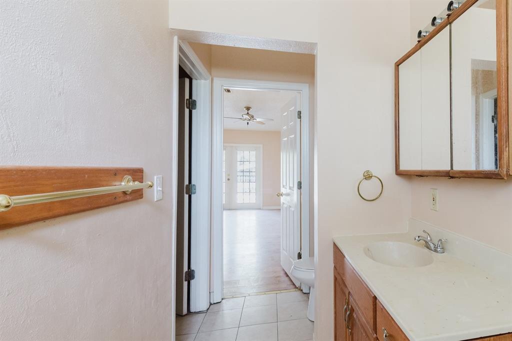 7804 Wilmar Court Port Richey, FL 34668 - Photo 22 of 82 a bathroom with a sink and mirror