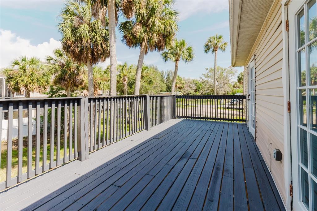 7804 Wilmar Court Port Richey, FL 34668 - Photo 25 of 82 a view of a balcony with wooden floor