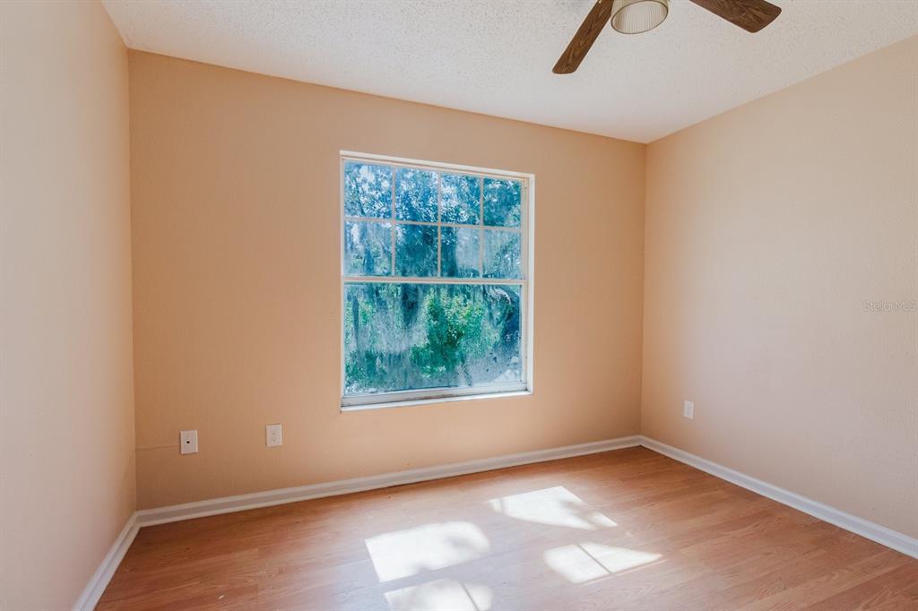 7804 Wilmar Court Port Richey, FL 34668 - Photo 32 of 82 an empty room with a window