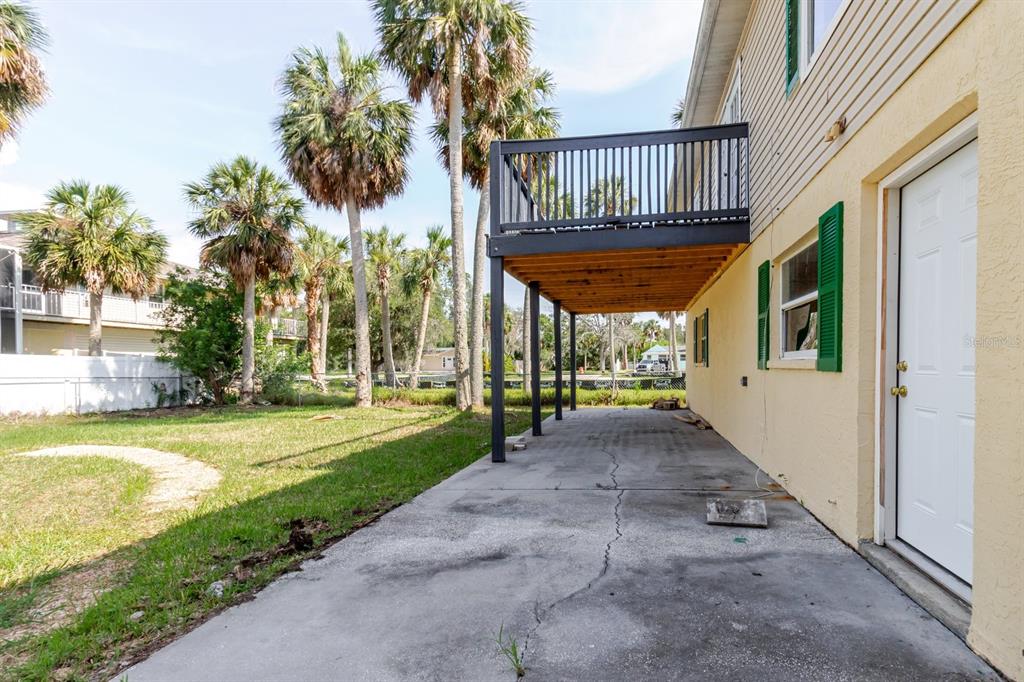 7804 Wilmar Court Port Richey, FL 34668 - Photo 45 of 82 a view of a house with backyard and sitting area