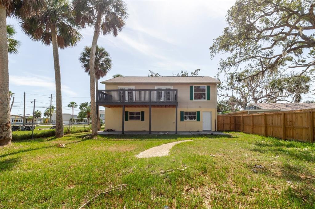 7804 Wilmar Court Port Richey, FL 34668 - Photo 48 of 82 a view of a house with a swimming pool and a yard