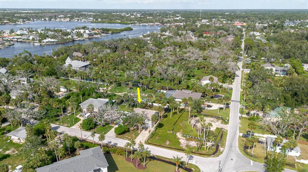 7804 Wilmar Court Port Richey, FL 34668 - Photo 57 of 82 an aerial view of residential houses with outdoor space and trees