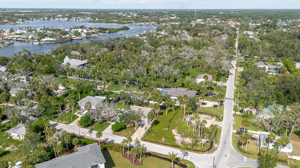 7804 Wilmar Court Port Richey, FL 34668 - Photo 58 of 82 an aerial view of residential houses with outdoor space and trees