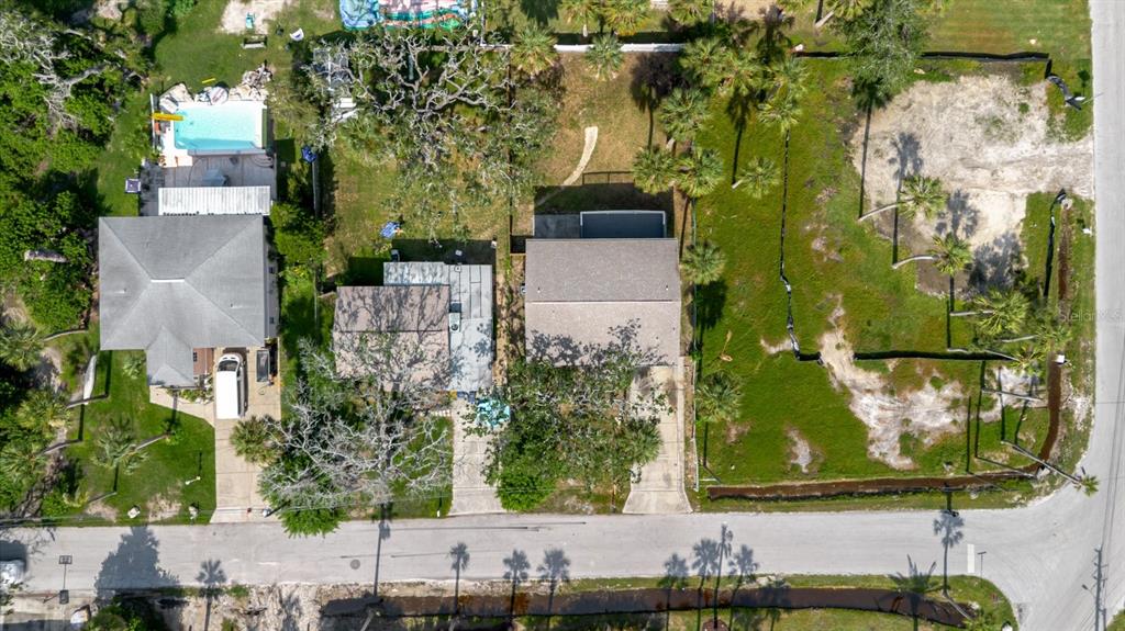 7804 Wilmar Court Port Richey, FL 34668 - Photo 82 of 82 an aerial view of a house with a yard