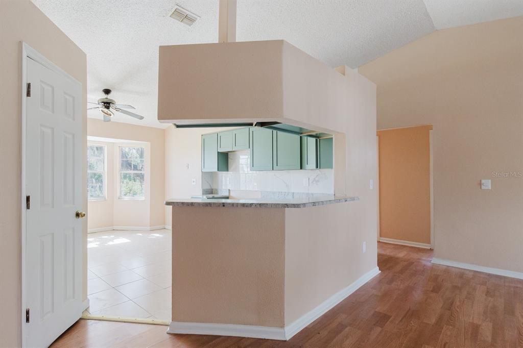 7804 Wilmar Court Port Richey, FL 34668 - Photo 9 of 82 a bathroom with a granite countertop sink and a mirror
