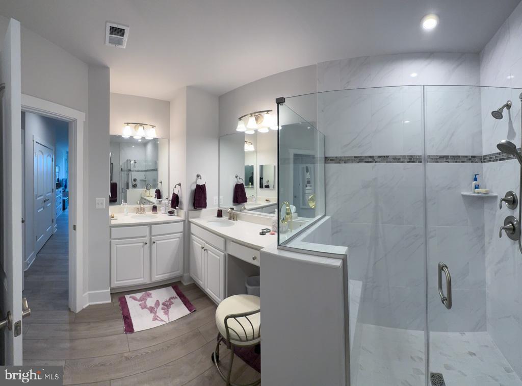 1000 Herons Nest Way, Unit 32 Chester, MD 21619 - Photo 14 of 28 a room with a sink toilet and shower