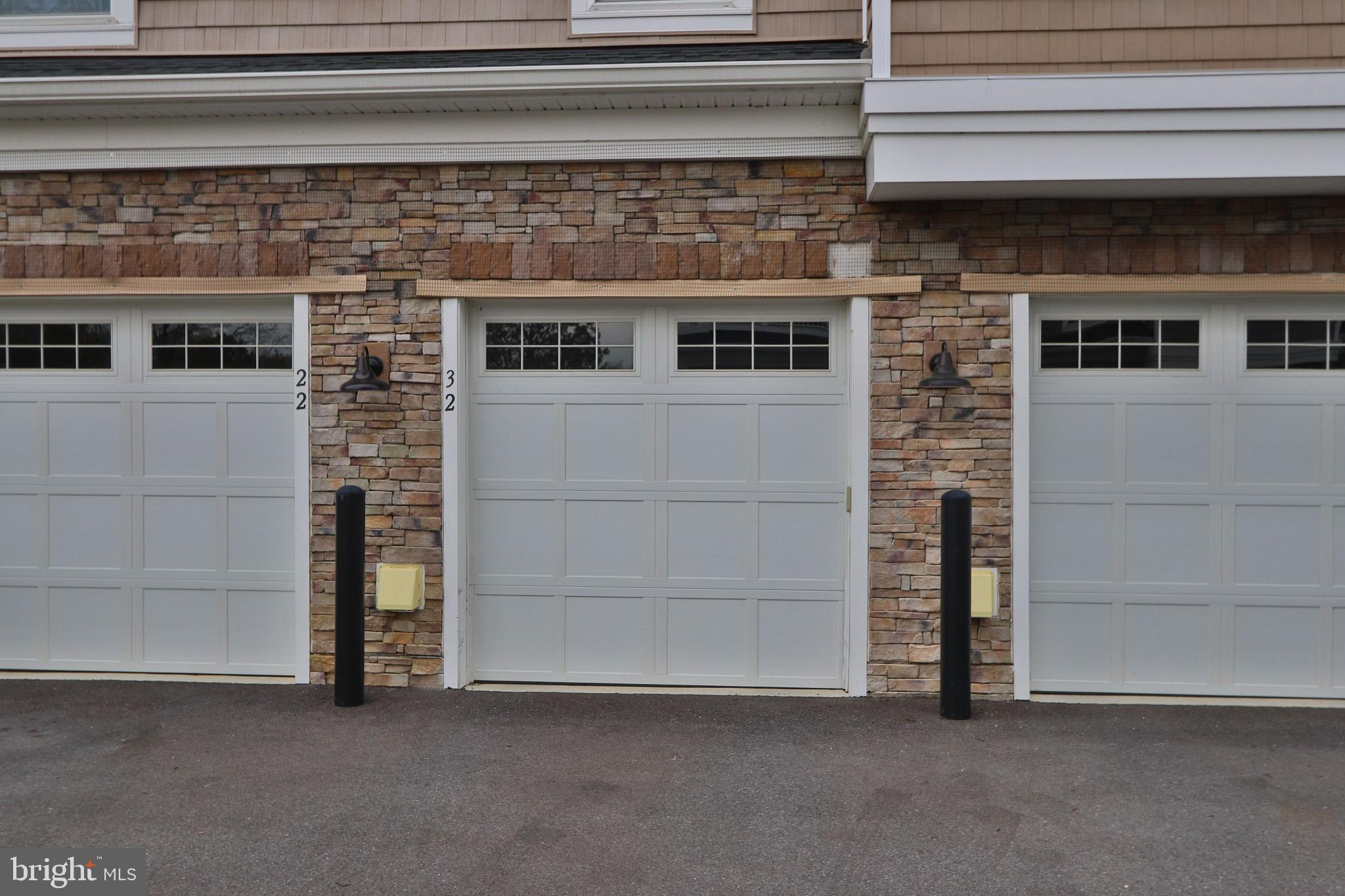 1000 Herons Nest Way, Unit 32 Chester, MD 21619 - Photo 21 of 28 a living room with a stove and a refrigerator