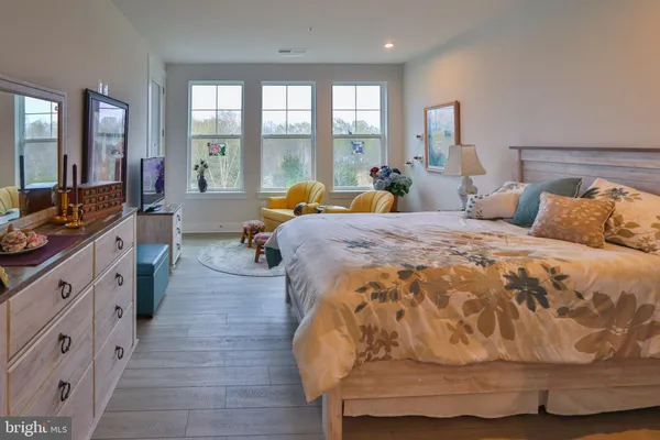 a bed room with a bed and a large window