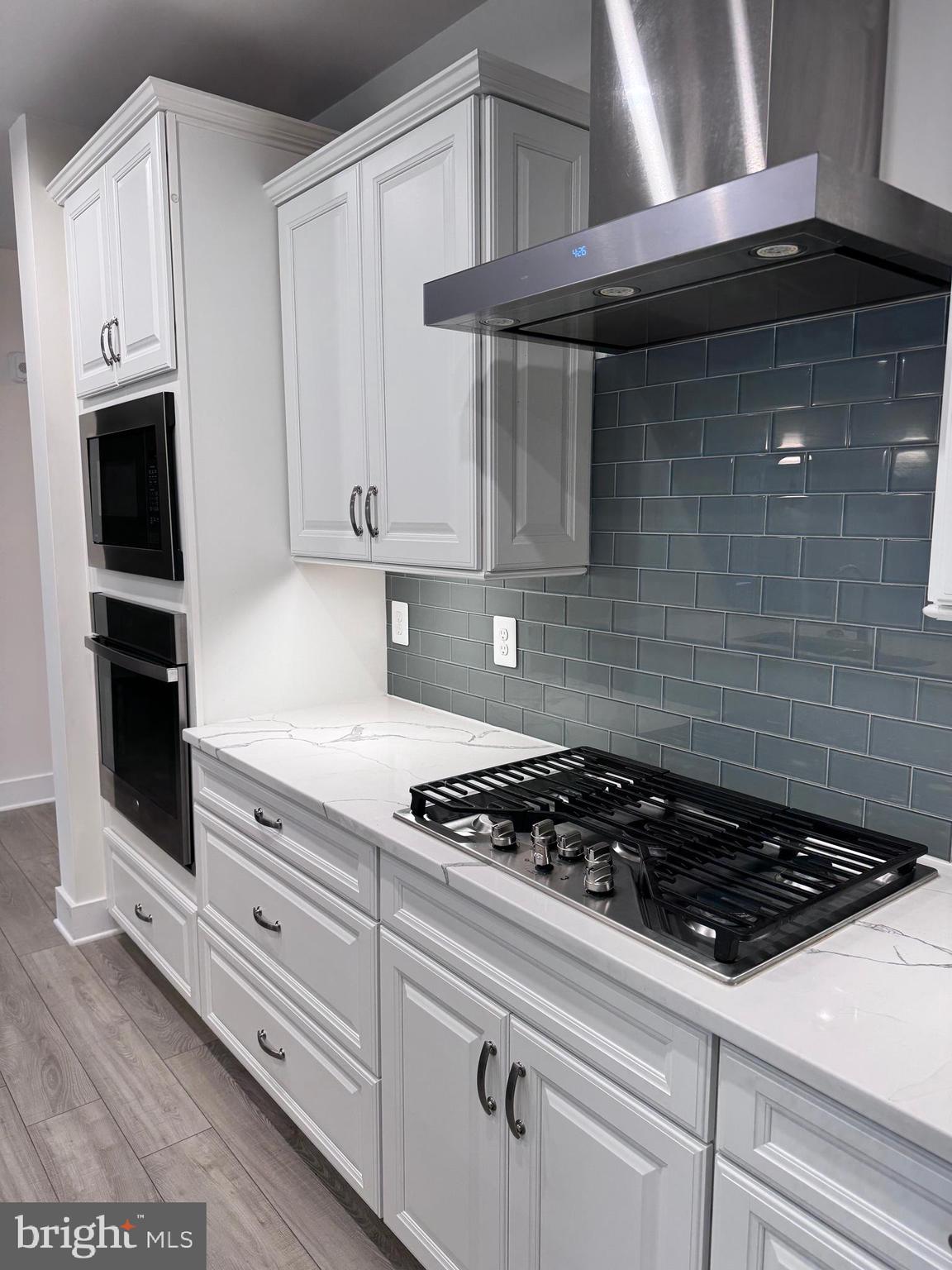 1000 Herons Nest Way, Unit 32 Chester, MD 21619 - Photo 6 of 28 a kitchen with granite countertop stainless steel appliances and cabinets