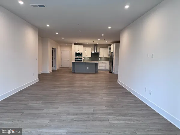 a view of kitchen with wooden floor