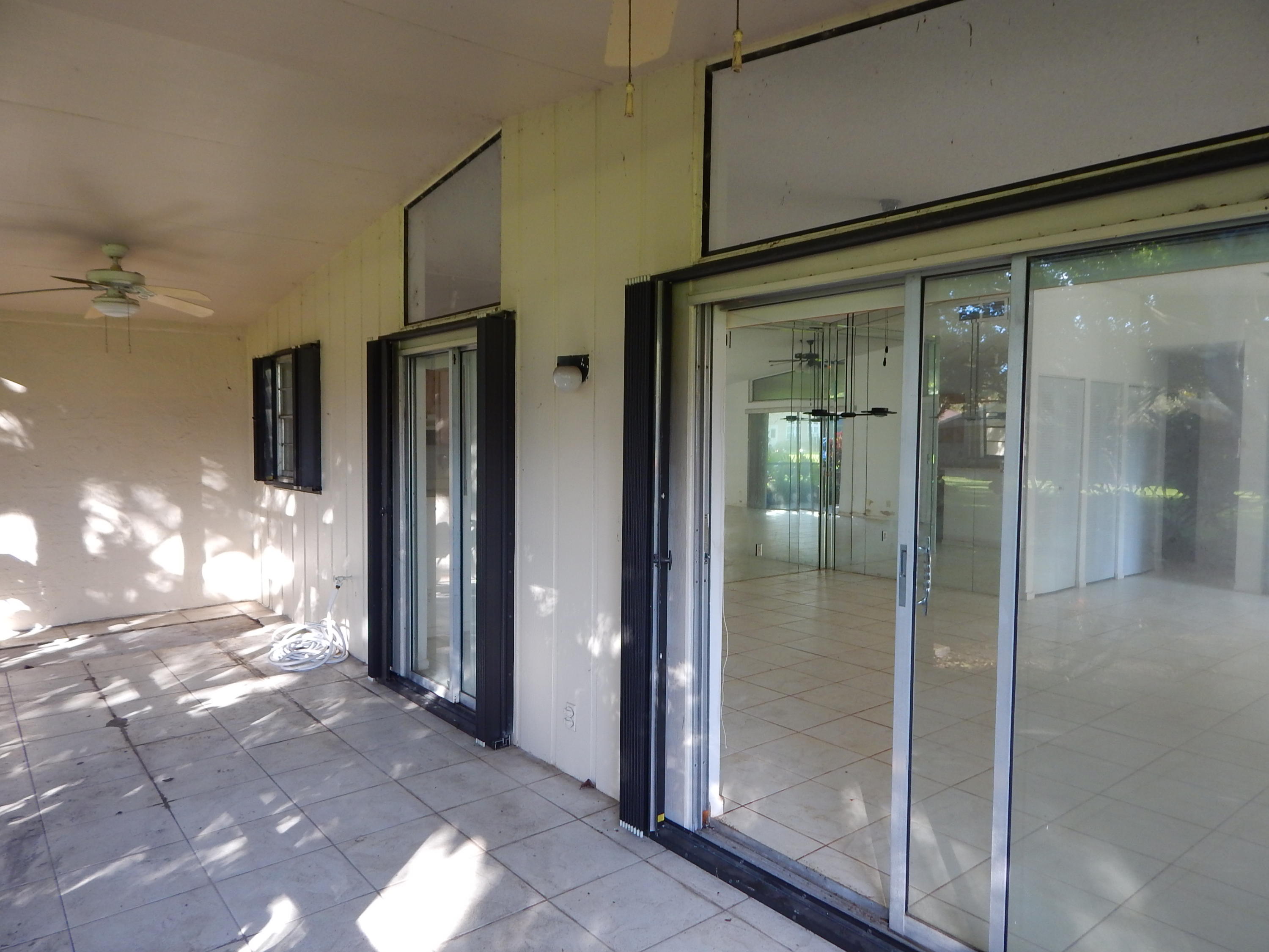 22281 Timberly Drive Boca Raton, FL 33428 - Photo 8 of 19 Accordian Shutters