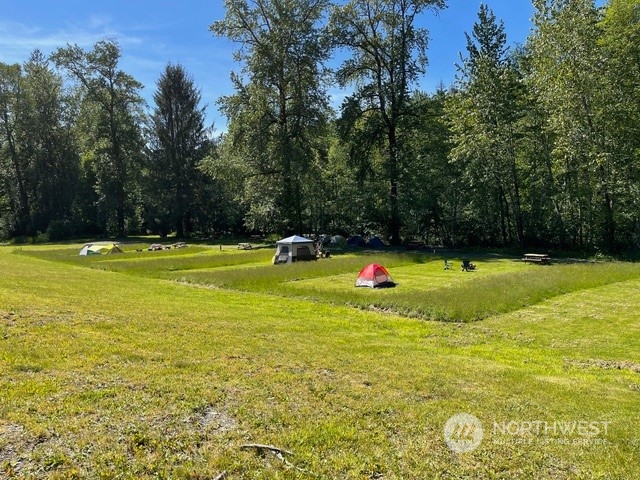 0 Smith Rd Forks Forks, WA 98331 - Photo 24 of 26 a view of a swimming pool with an outdoor space and seating area