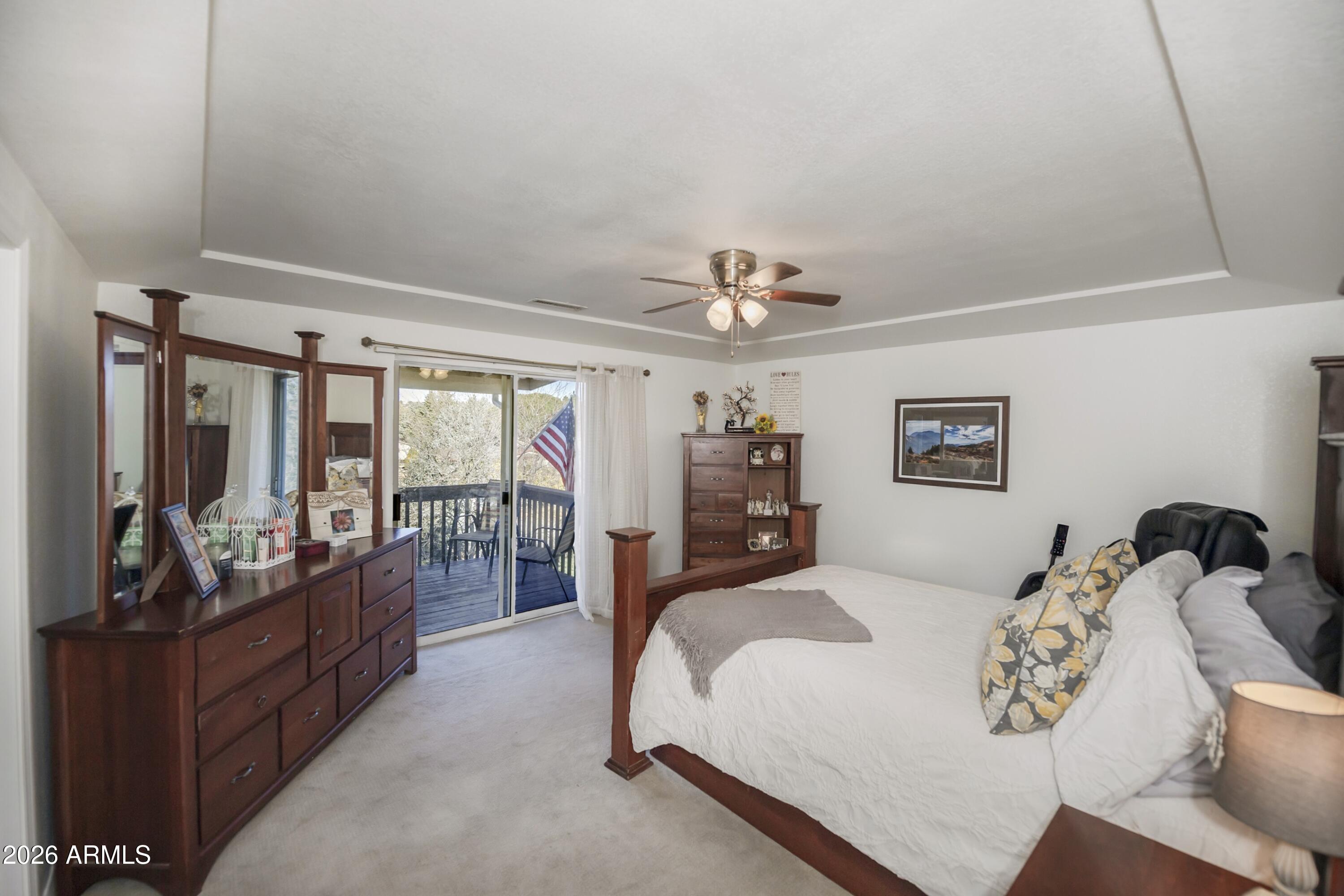 11160 Pima Road Dewey, AZ 86327 - Photo 12 of 58 a bed room with a bed and a large window