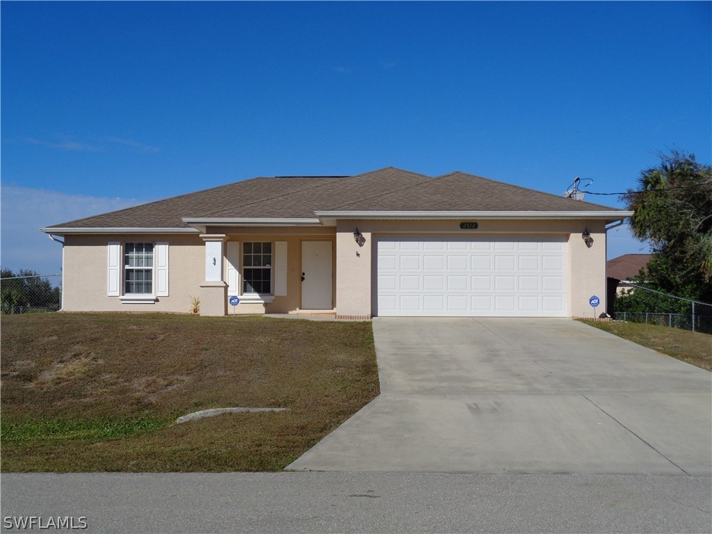 front view of a house with a yard
