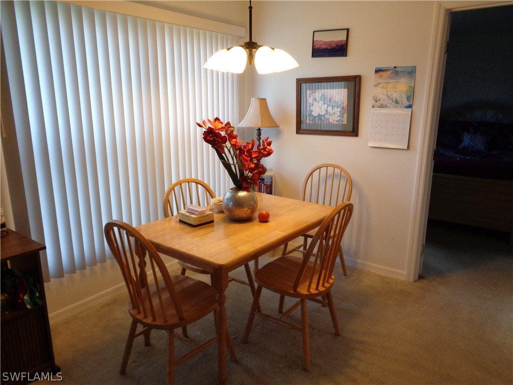 2512 53rd Street West Lehigh Acres, FL 33971 - Photo 12 of 25 a dining room with furniture and window