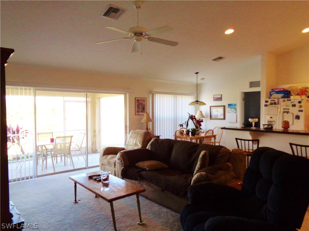 2512 53rd Street West Lehigh Acres, FL 33971 - Photo 8 of 25 a living room with furniture and a large window