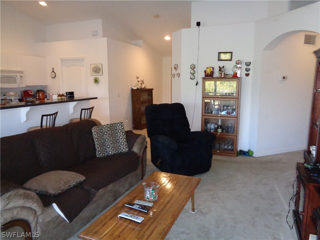 2512 53rd Street West Lehigh Acres, FL 33971 - Photo 9 of 25 a living room with furniture and a window