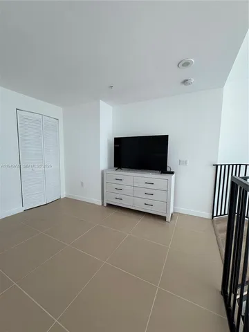 a room with table and chairs