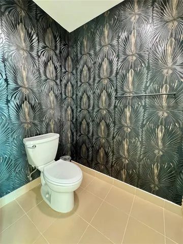 a view of a wooden fence with a potted plant