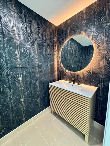 a view of a hall way with furniture