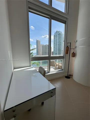 a view of a room with a large window