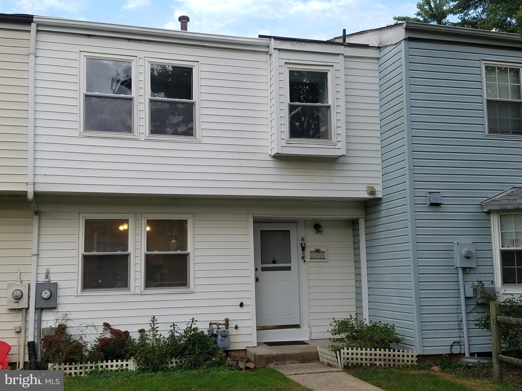 17433 Hughes Road Poolesville, MD 20837 - Photo 1 of 20 a view of a brick house with many windows