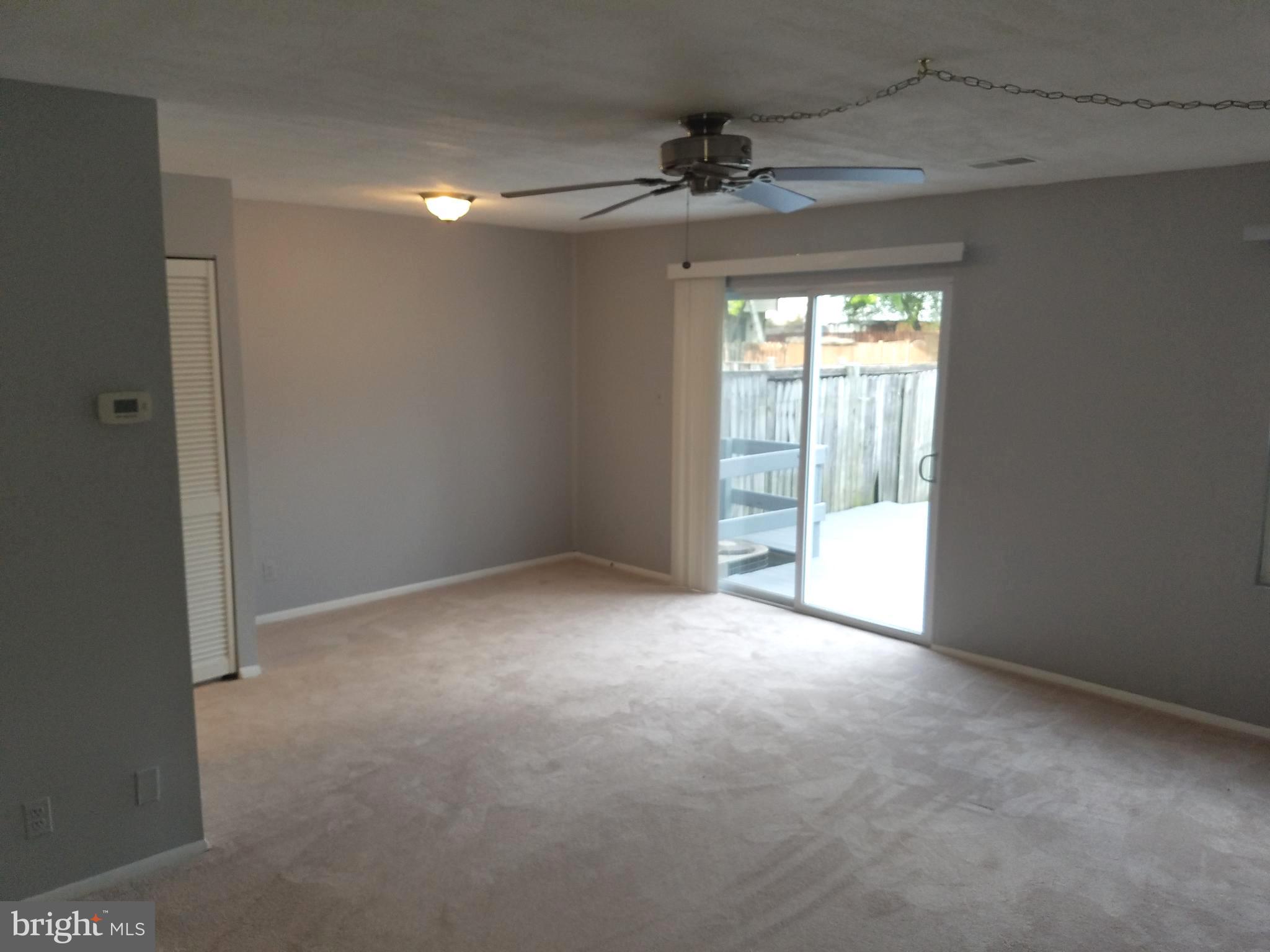 17433 Hughes Road Poolesville, MD 20837 - Photo 3 of 20 a view of an empty room with a window