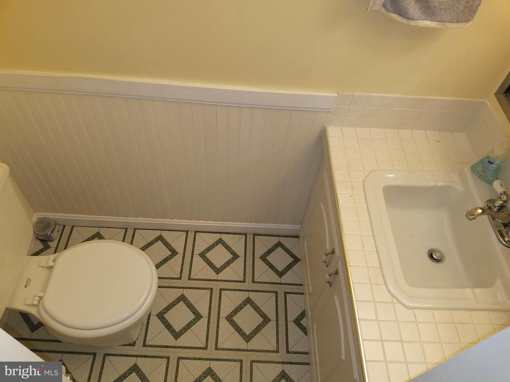 17433 Hughes Road Poolesville, MD 20837 - Photo 6 of 20 a bathroom with a sink and shower