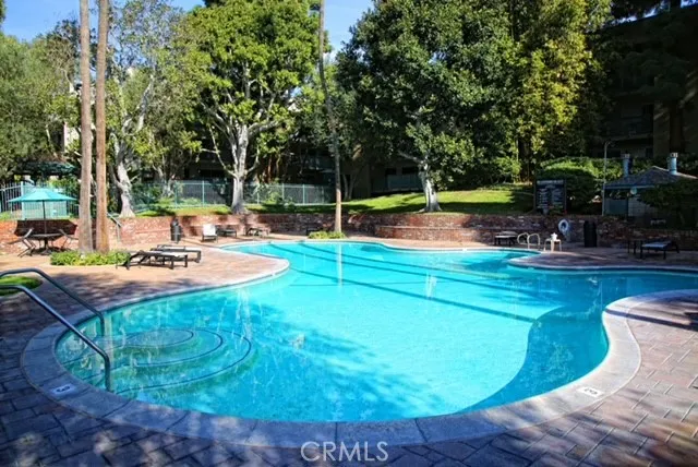 a view of a swimming pool with a patio