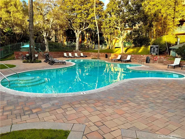 a view of a swimming pool with a sitting area