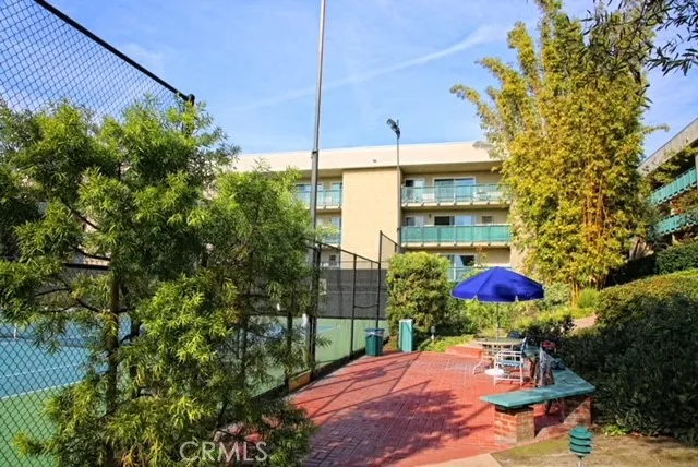 a living room with furniture large window and flat screen tv