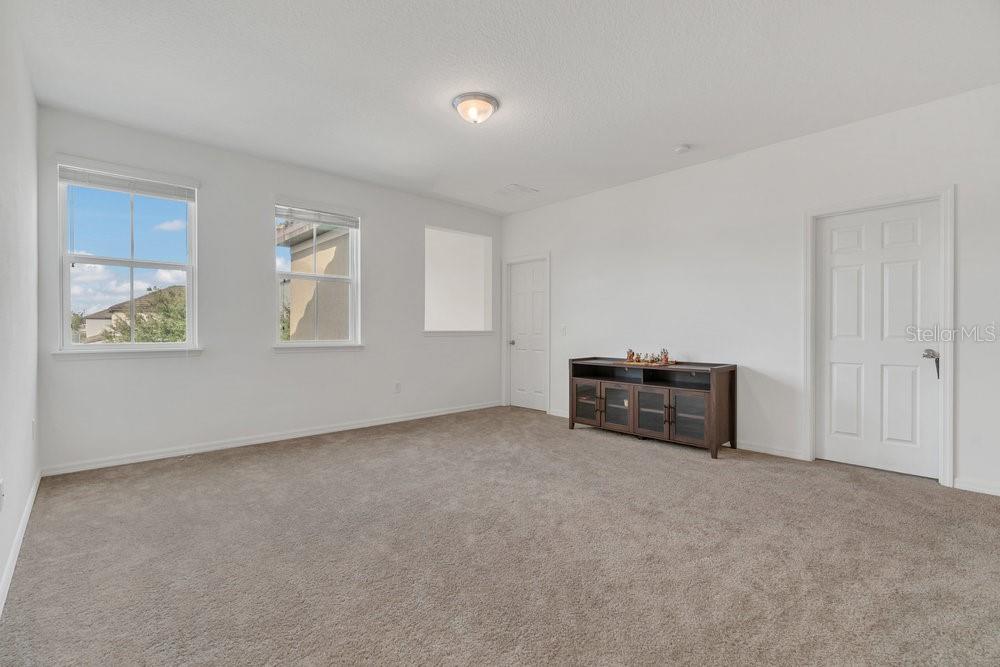 12880 Westside Vlg Loop Windermere, FL 34786 - Photo 21 of 42 an empty room with windows and closet