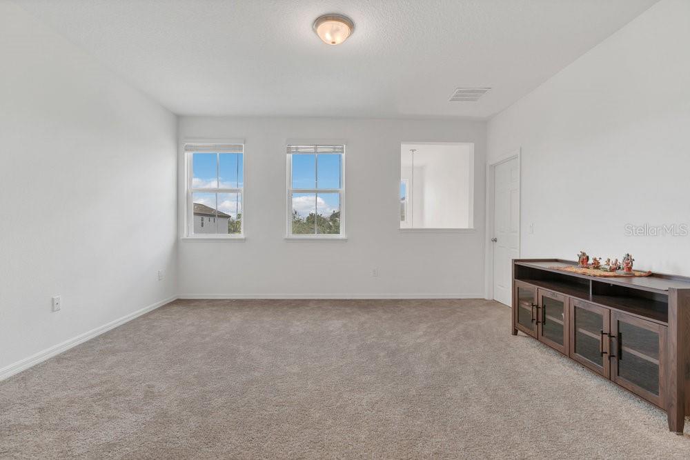 12880 Westside Vlg Loop Windermere, FL 34786 - Photo 22 of 42 a view of an empty room with a window