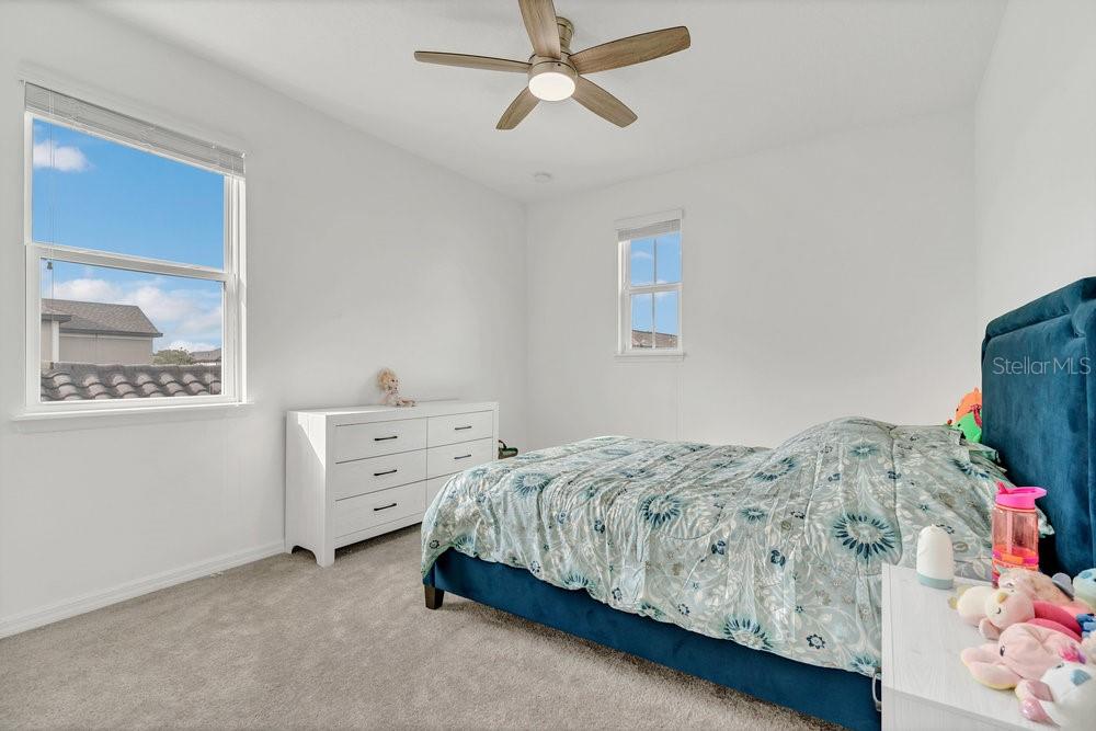 12880 Westside Vlg Loop Windermere, FL 34786 - Photo 23 of 42 a bedroom with a bed and a window