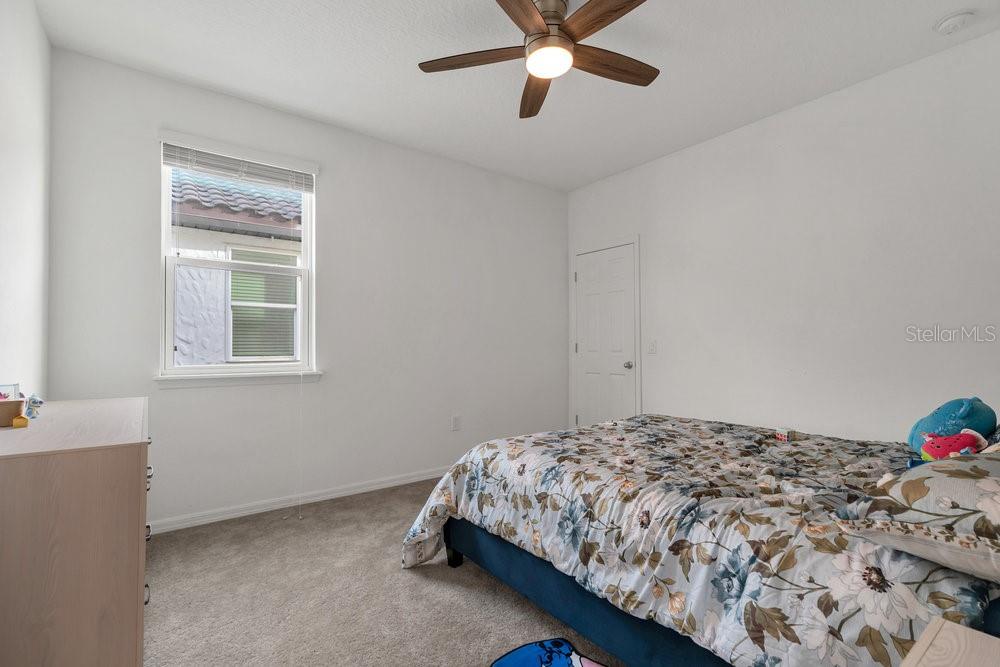 12880 Westside Vlg Loop Windermere, FL 34786 - Photo 27 of 42 a bedroom with a bed and a window