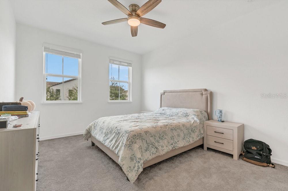 12880 Westside Vlg Loop Windermere, FL 34786 - Photo 28 of 42 a bedroom with a bed and a window