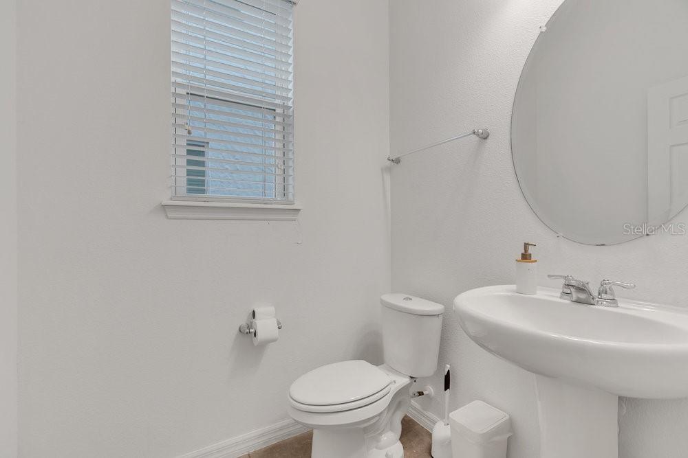 12880 Westside Vlg Loop Windermere, FL 34786 - Photo 30 of 42 a bathroom with a sink and a toilet