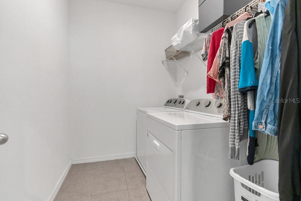 12880 Westside Vlg Loop Windermere, FL 34786 - Photo 31 of 42 a utility room with dryer and washer