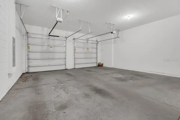 a view of a yard with swimming pool and sitting area