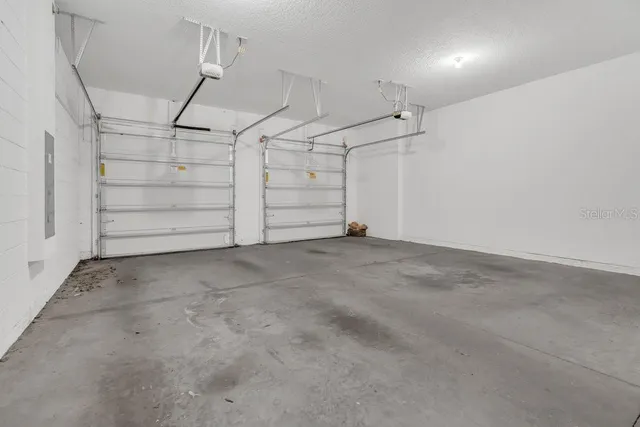 a view of a yard with swimming pool and sitting area